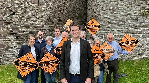 David Chadwick in front of Lib Dem volunteers