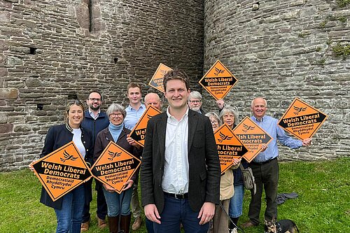 David Chadwick surrounded by supporters